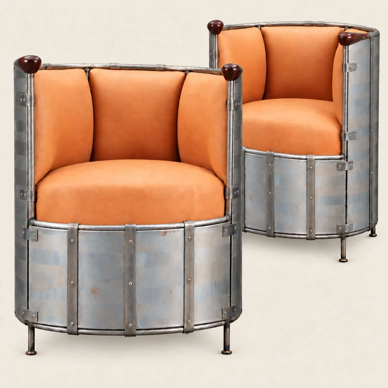 A pair of Mats Theselius moose-leather armchairs with etched metal shells.